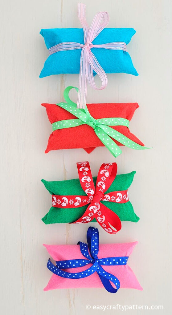 Blue, red, green, pink felts with ribbon.