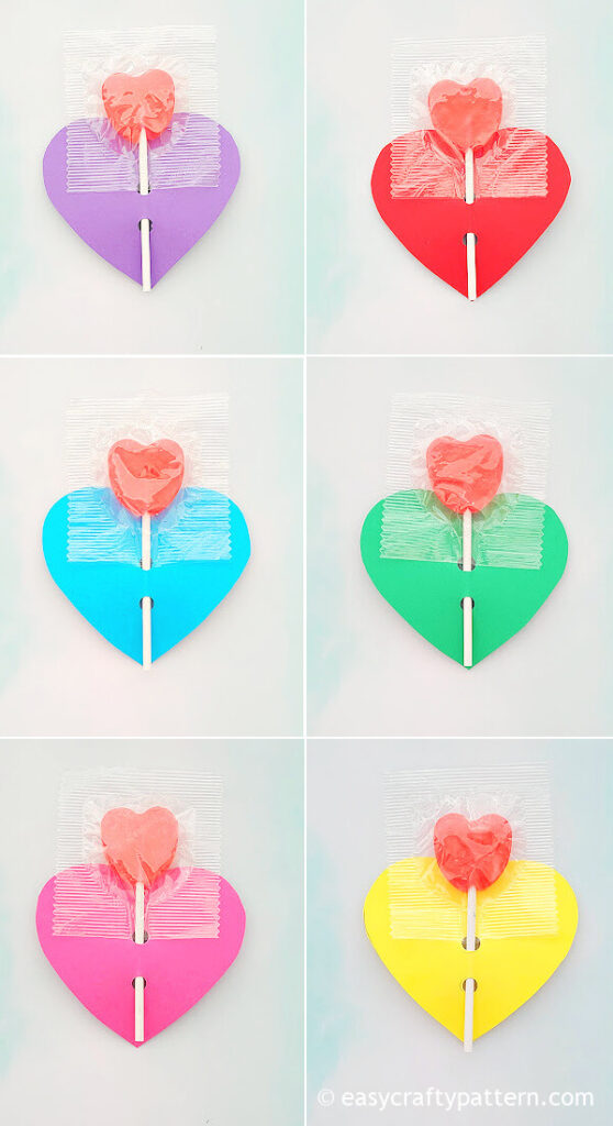 Colourful heart paper with sweet suckers.
