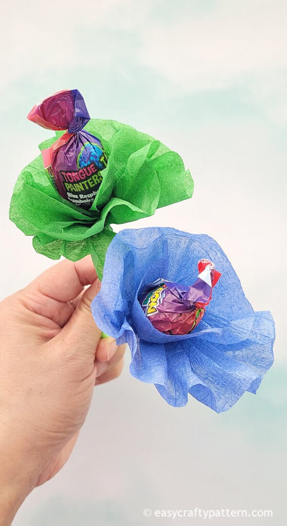 Green and blue crepe paper on lollipop.