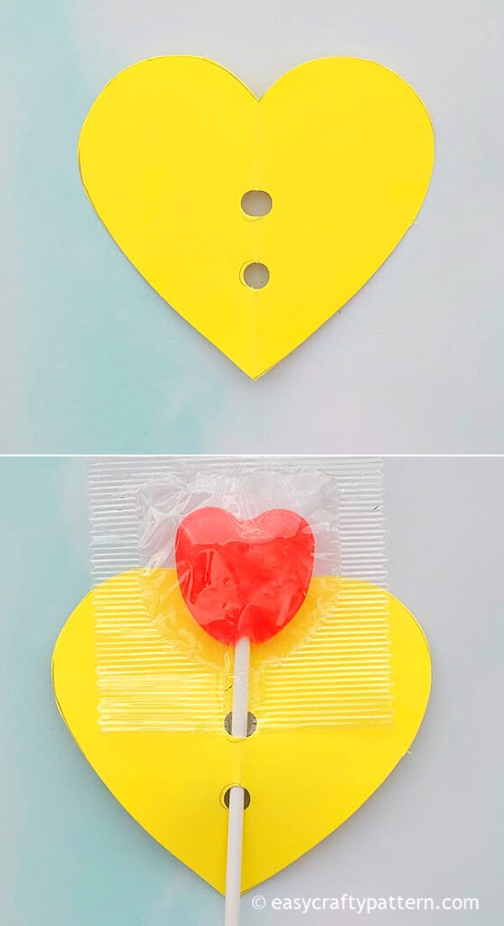 Red lollipop with yellow heart paper.