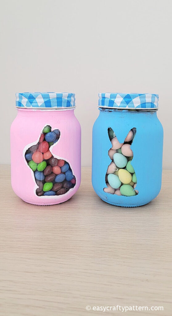 Blue and pink jars with candies.