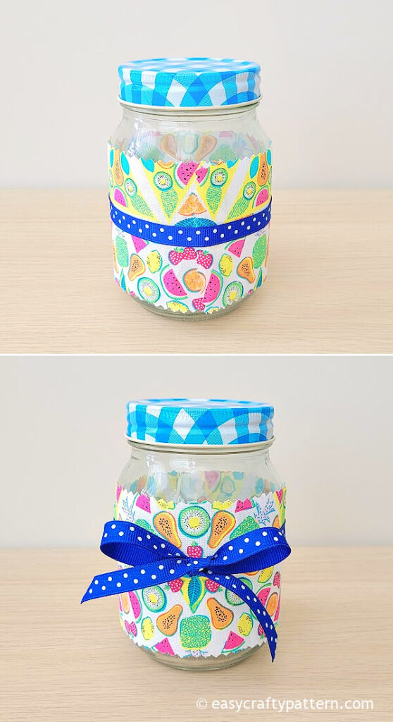 Mason jar with fabric and blue ribbon.