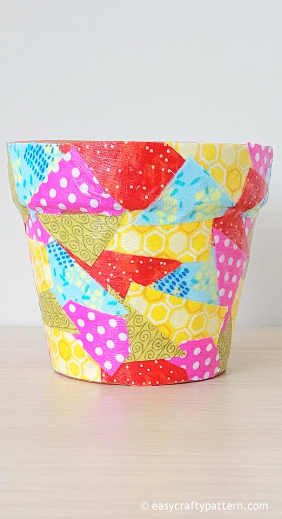 Clay pot decoupage with fabric mosaic.