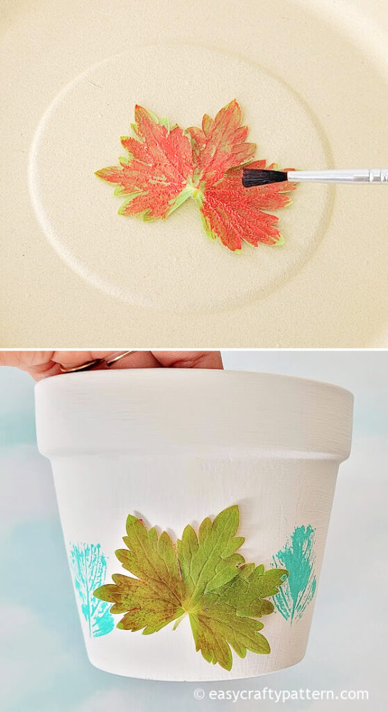 Stamping painted leaf on clay pot.