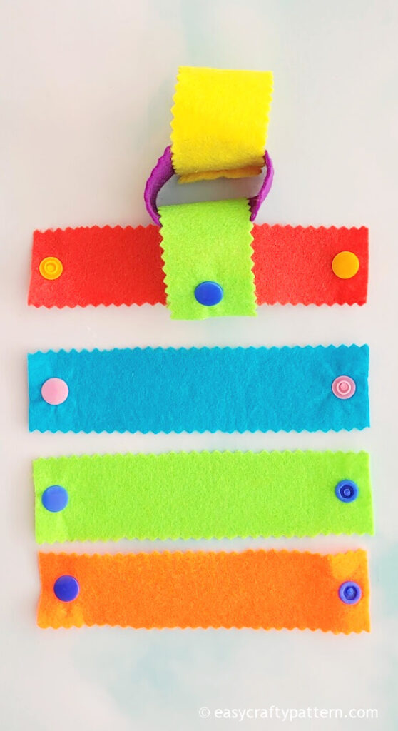 Colourful felt loop with button.