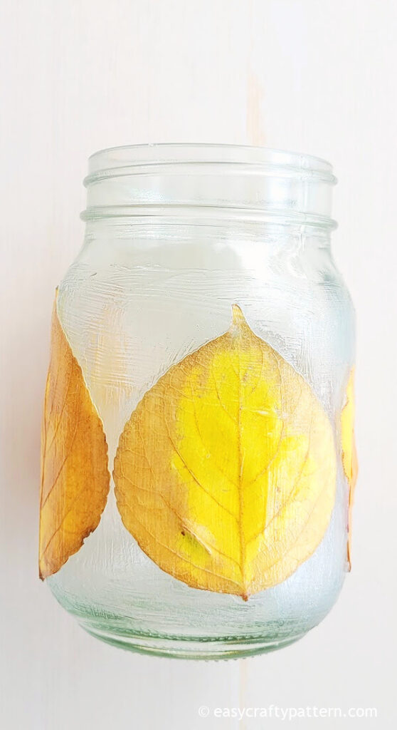 Leaf glued on mason jar.