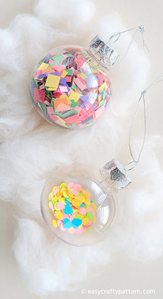 Clear ornament with colorful paper.
