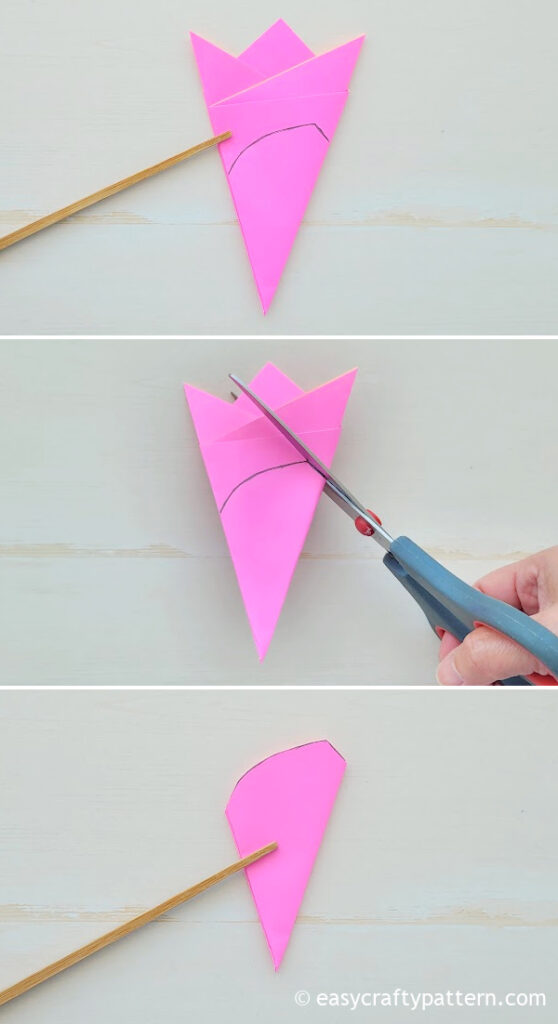 Cutting the template on the pink paper.