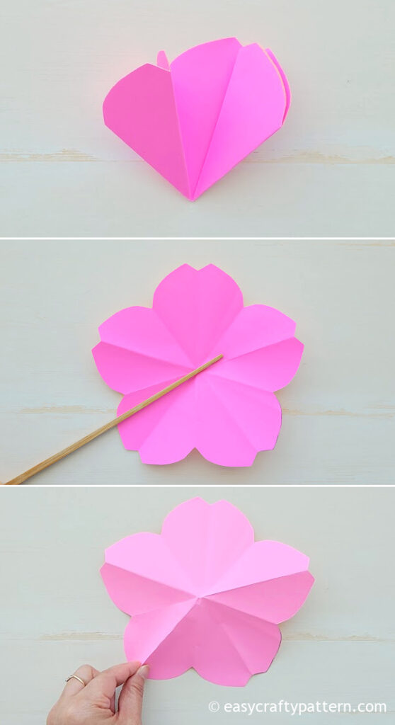 Fixing the crease on the paper flower.