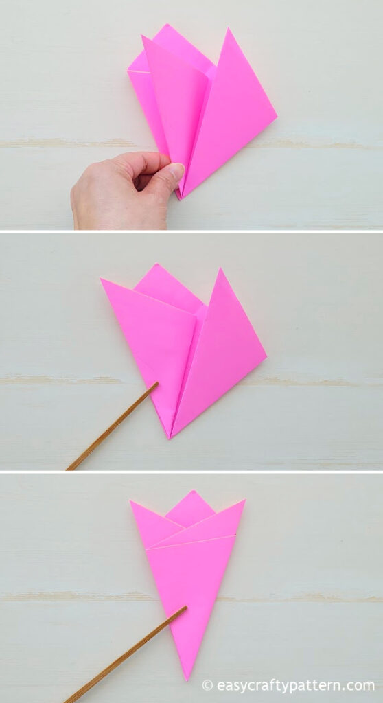 Folding the paper into small triangle.