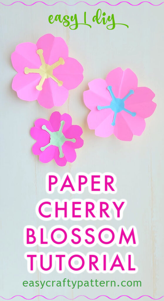 Pink paper cherry blossom with paper stamen.
