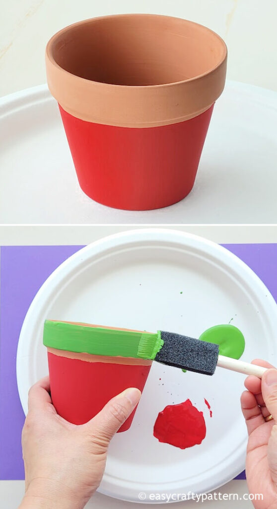 Painting clay pot with green.