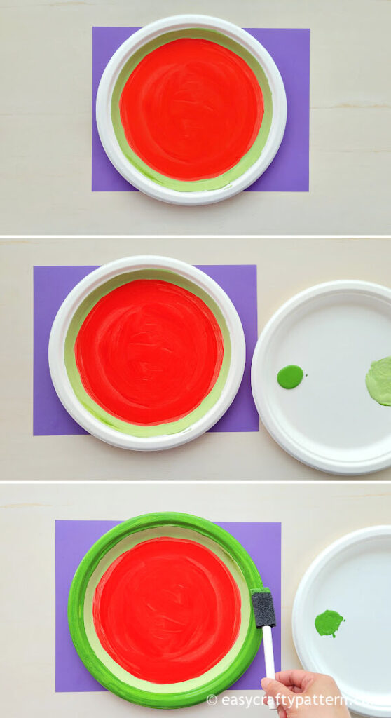 Painting green on paper plate.