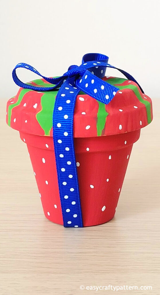 Gift jar clay pot with ribbon.